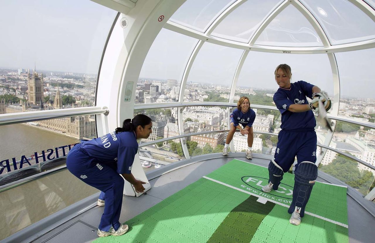 Isa Guha, Rosalie Birch and Clare Connor play during a promotional shoot on the London Eye, July 18, 2005