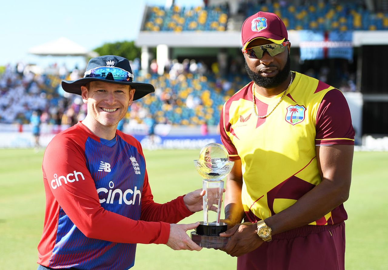 Eoin Morgan and Kieron Pollard pose with the trophy, West Indies vs England, 1st T20I, Kensington Oval, Barbados, January 22, 2022