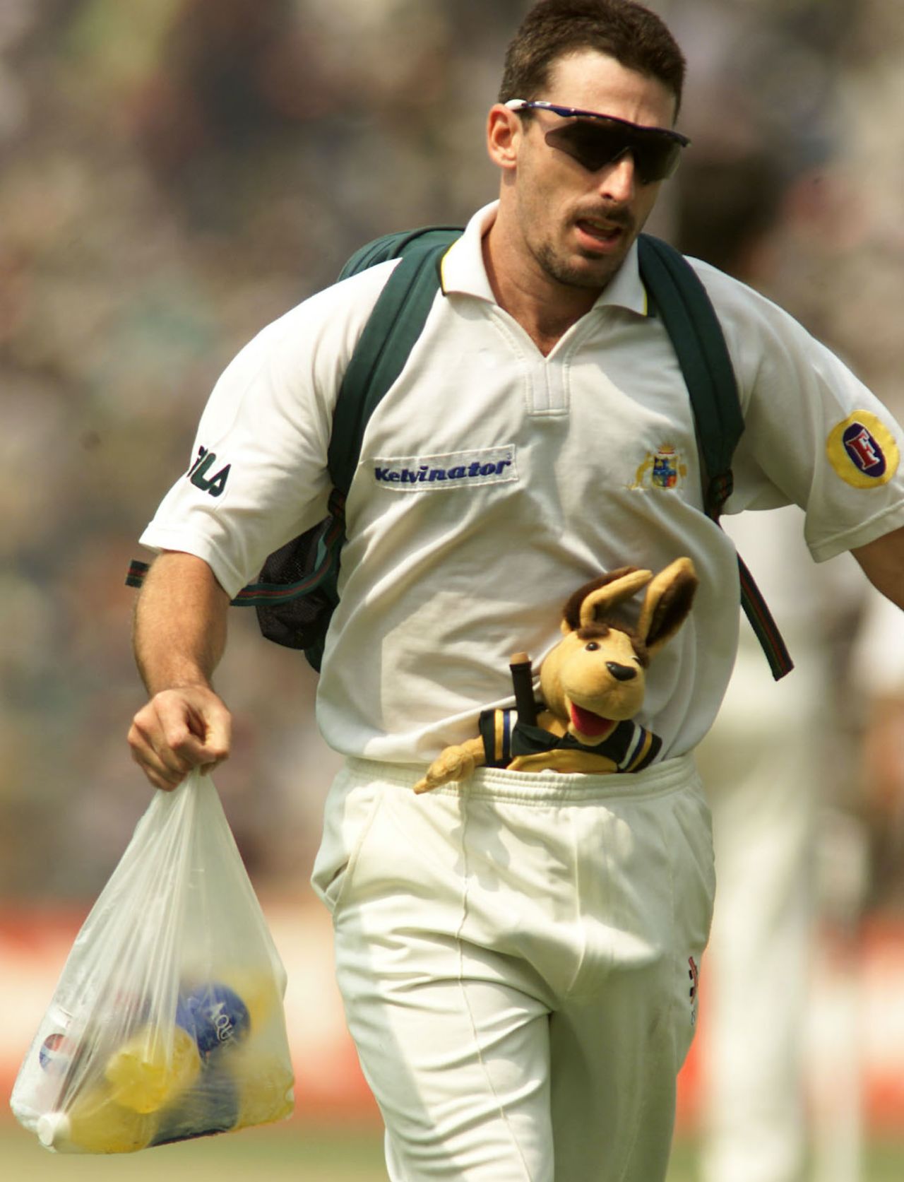 Damien Fleming carries drinks with the team mascot in his trousers, day four, second Test, India vs Australia, Eden Gardens, Kolkata, India, March 14, 2001