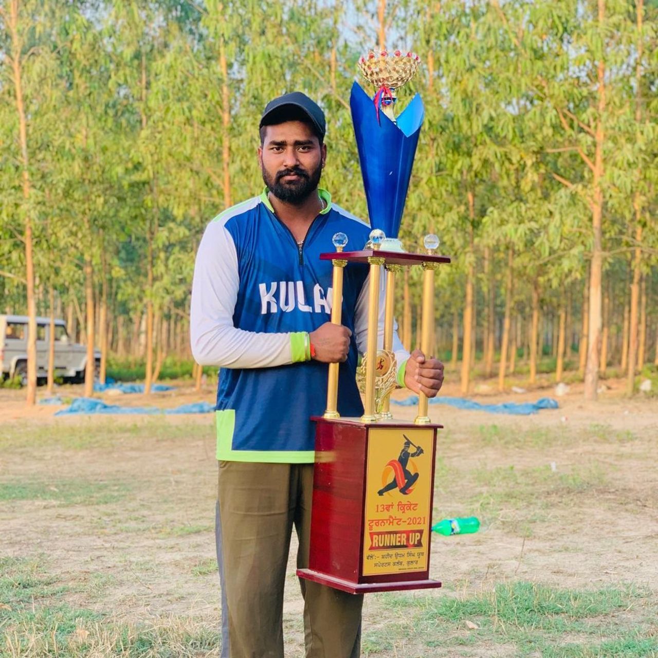 Ramesh Kumar poses with the trophy, April 26, 2021