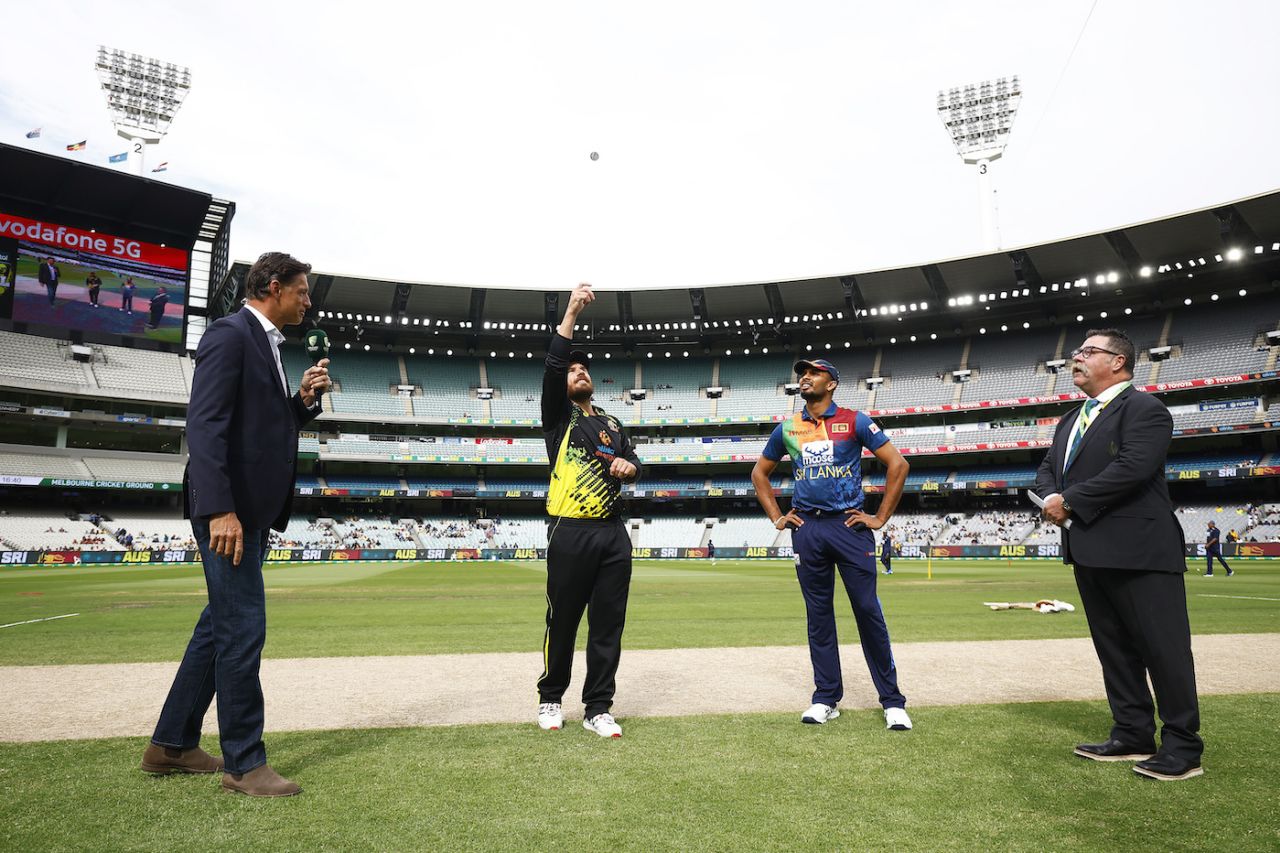 Aaron Finch flips the coin as Dasun Shanaka looks on, Australia vs Sri Lanka, 5th T20I, Melbourne, February 20, 2022
