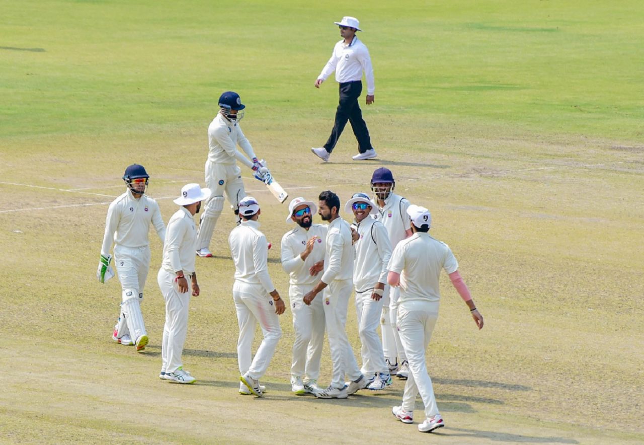 Vikas Mishra is mobbed by his team-mates, Delhi vs Jharkhand, 1st day, Ranji Trophy 2021-22, Guwahati, February 24, 2022