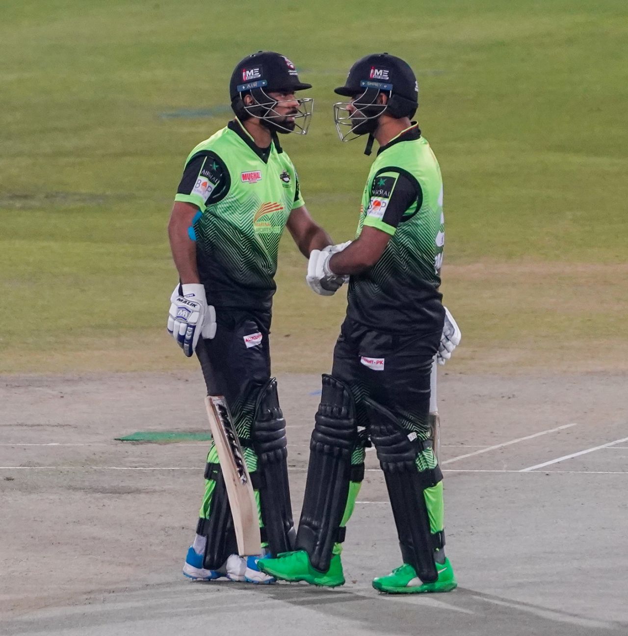 Kamran Ghulam and Abdullah Shafique have a chat during their partnership, Lahore Qalandars vs Multan Sultans, PSL 2022, Lahore, February 27, 2022