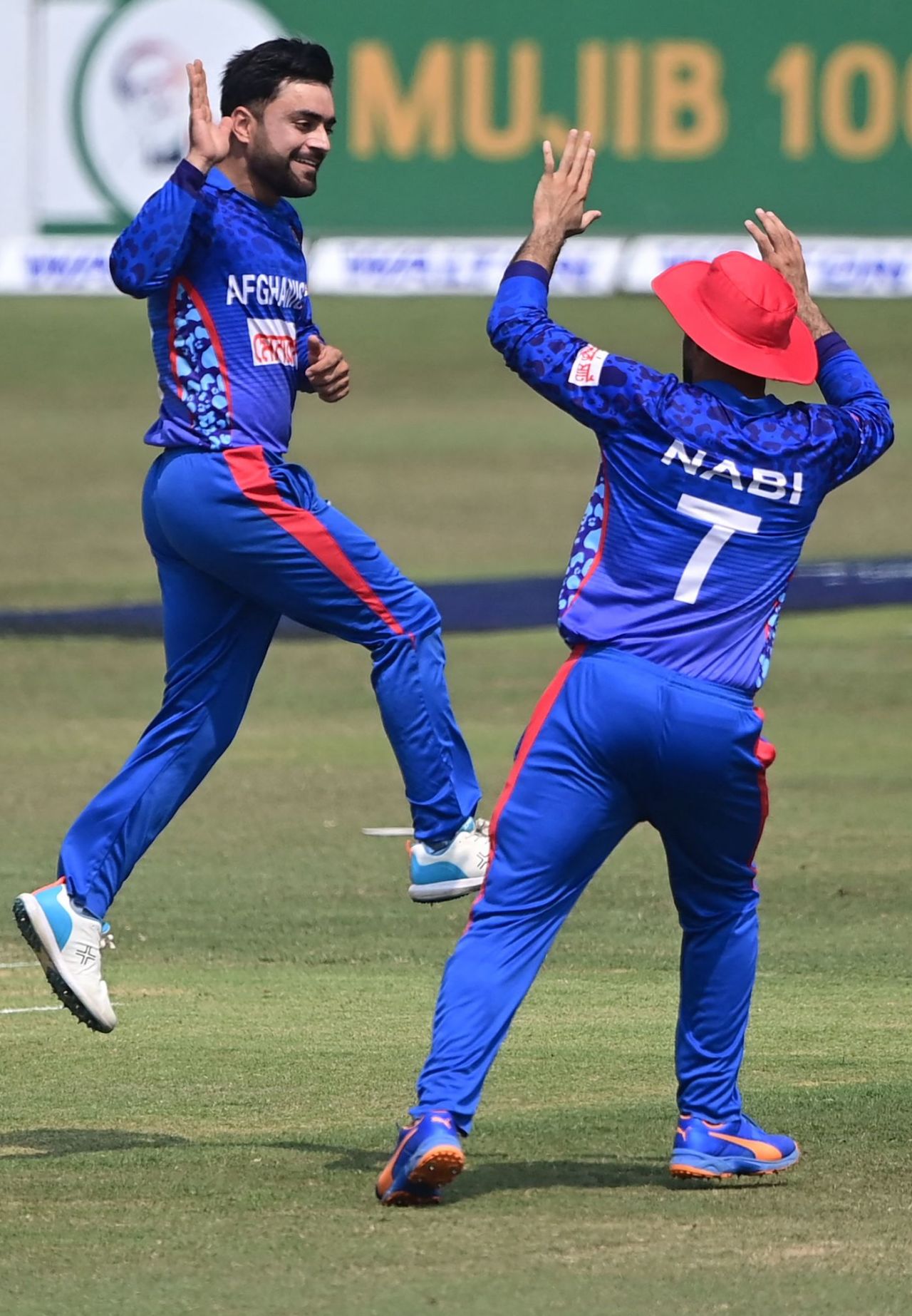 Rashid Khan celebrates Yasir Ali's wicket with Mohammad Nabi, Bangladesh vs Afghanistan, 3rd ODI, Chattogram, February 28, 2022