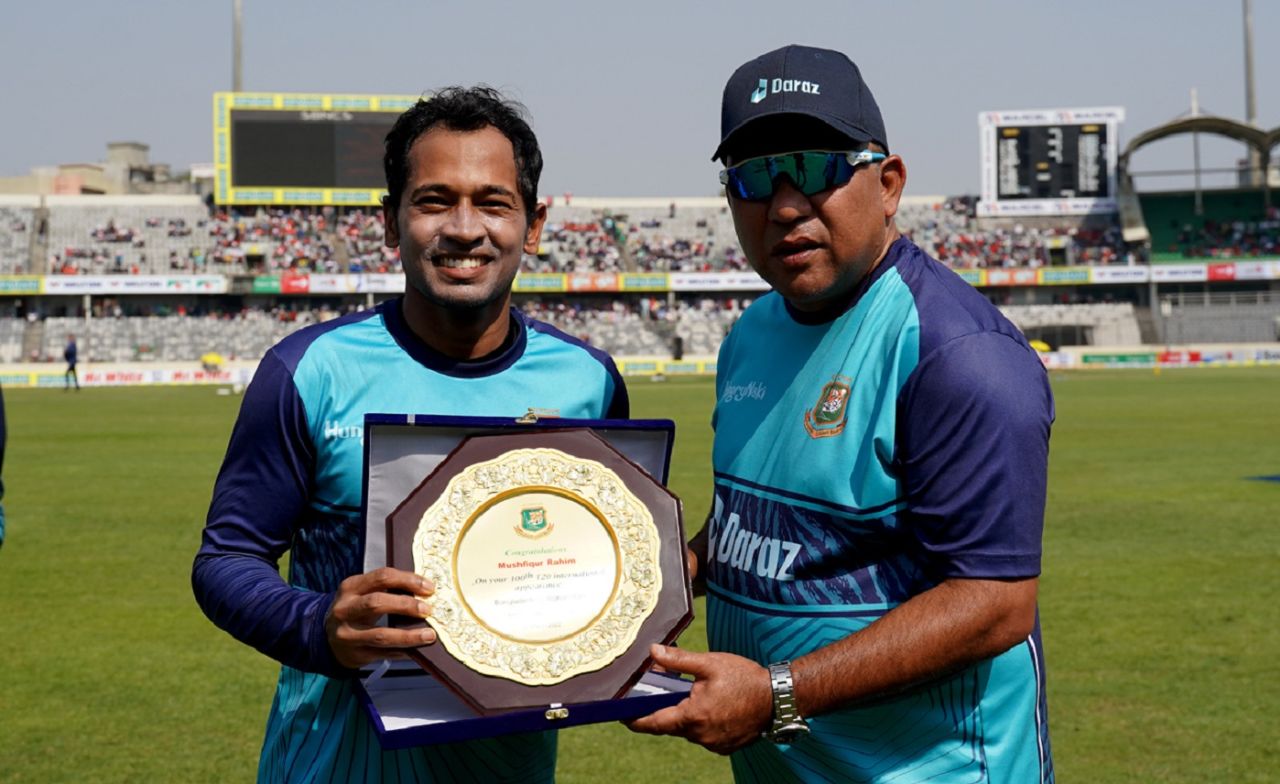 Mushfiqur Rahim receives a crest from Khaled Mahmud, the Bangladesh team director, ahead of his 100th T20I, Bangladesh vs Afghanistan, 2nd T20I, Dhaka, March 5, 2022