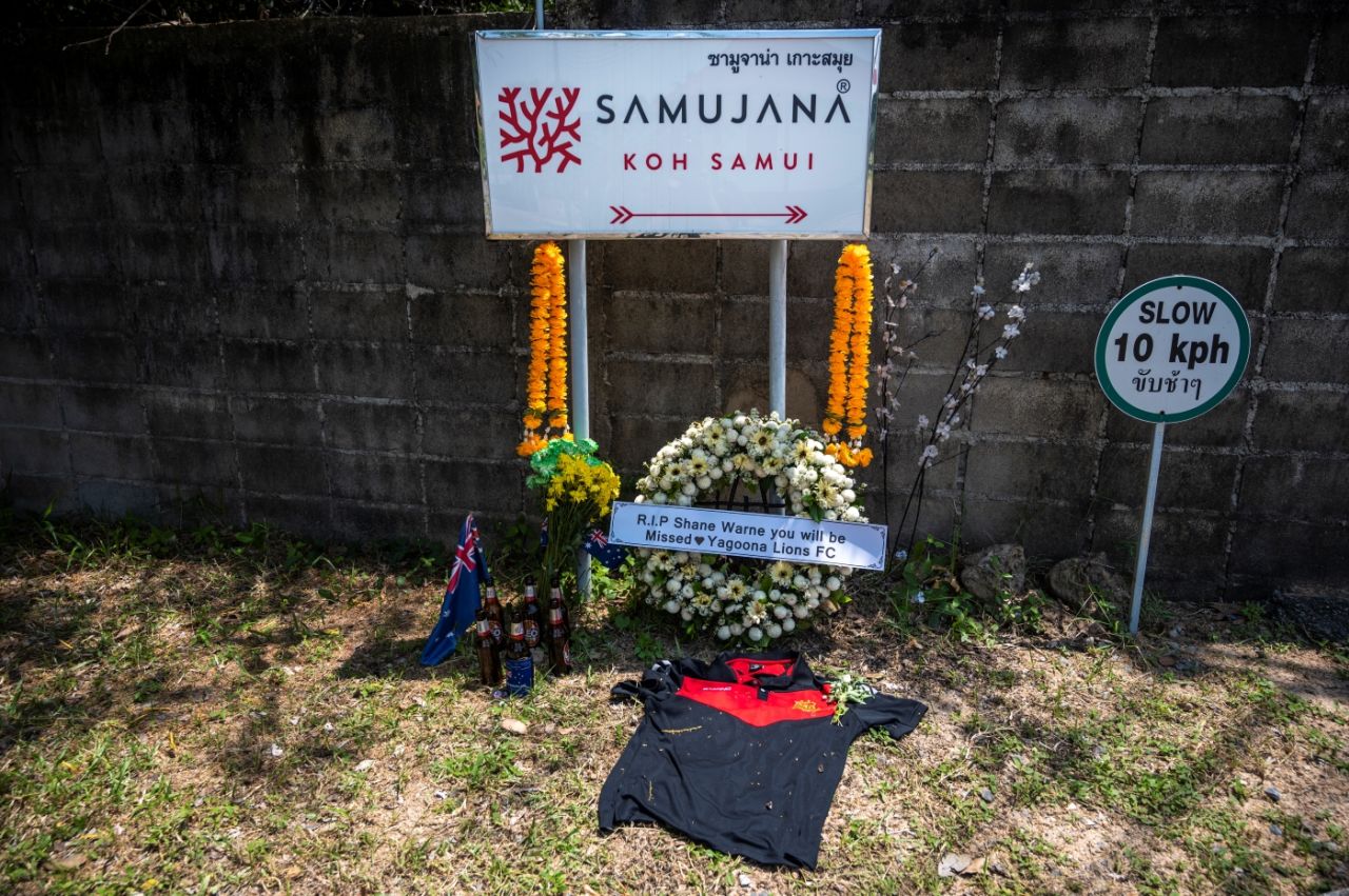 Tributes left at the sign for Samujana Villas, where Shane Warne was on holiday when he died, Koh Samui, Thailand, March 6