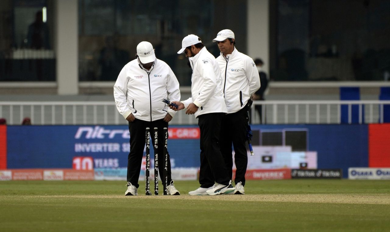 The umpires get the light meters out after bad light stopped play, Pakistan vs Australia, 1st Test, Rawalpindi, 3rd day, March 6, 2022