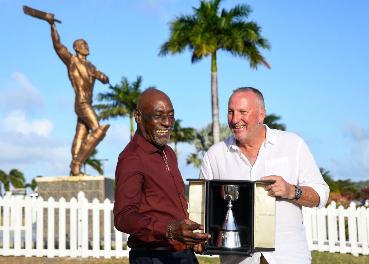 Sir Viv Richards and Sir Ian Botham are all smiles with the Richards-Botham Trophy, North Sound, March 6, 2022