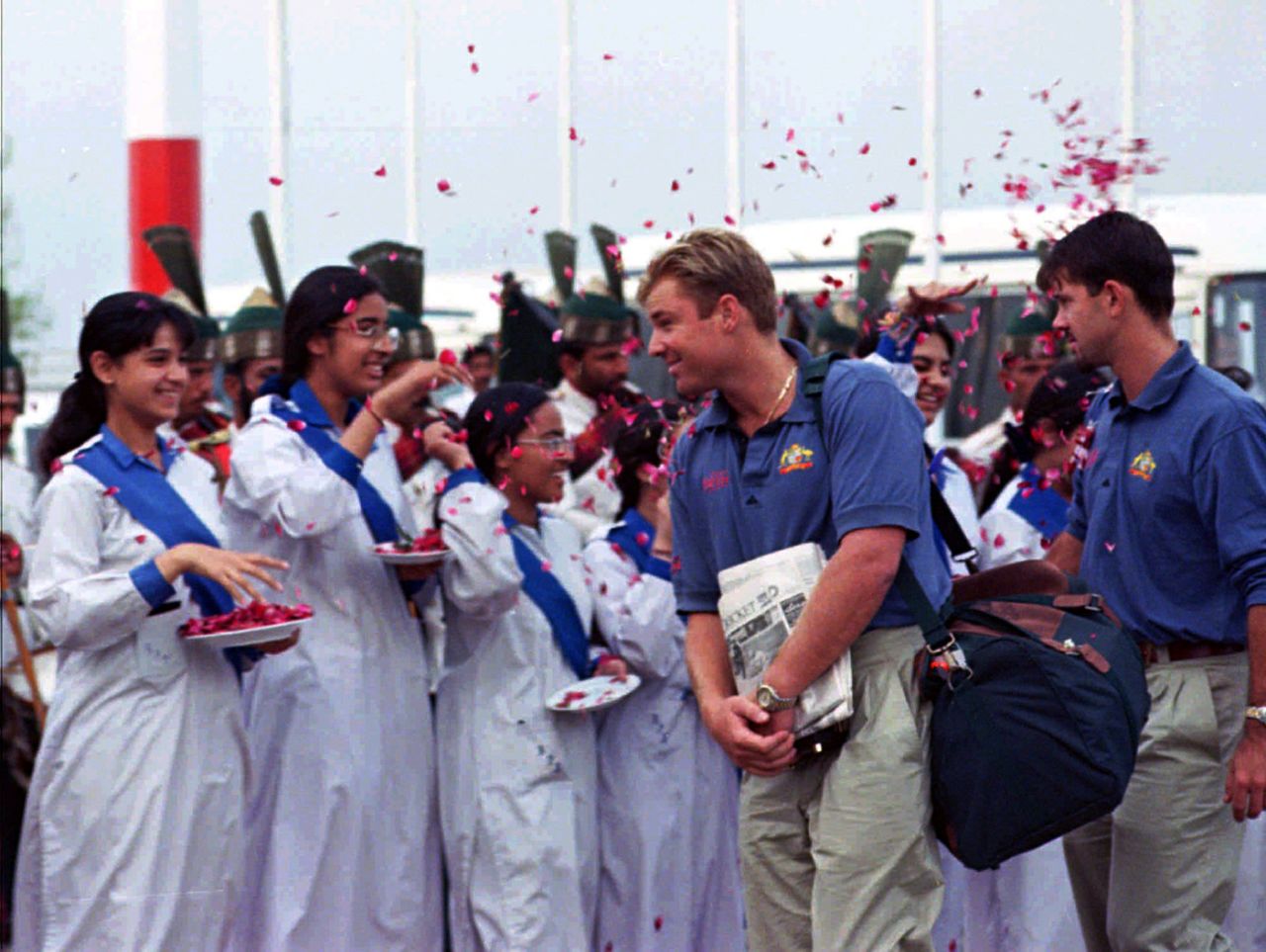 Shane Warne and Ricky Ponting get showered with rose petals by school kids in Lahore, March 15, 1996