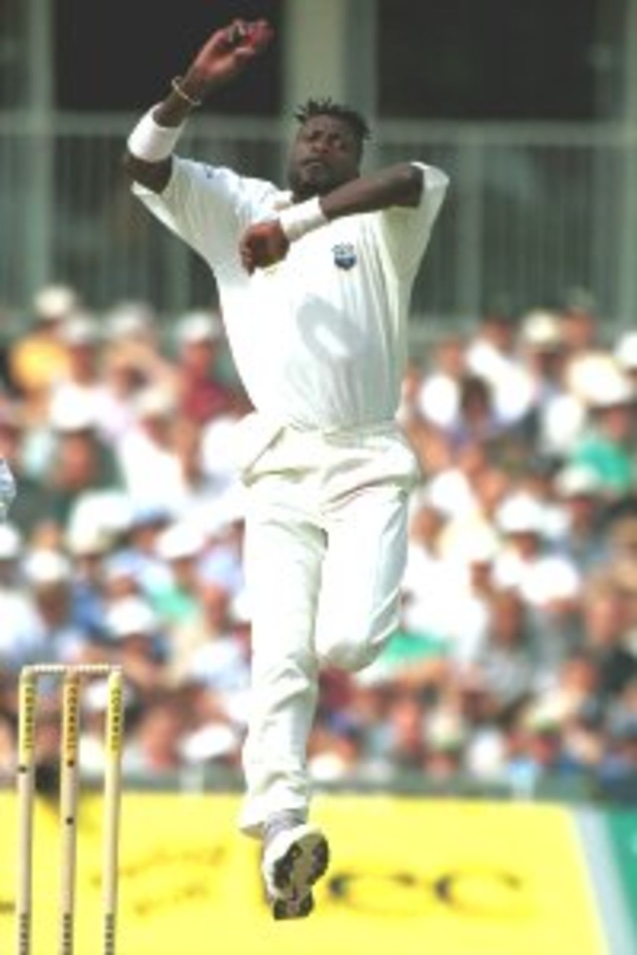 31 Aug 2000: Curtly Ambrose of the West Indies comes into attack batsman Michael Atherton of England during the Fifth Cornhill Insurance Test between England and the West Indies at the Oval, London.