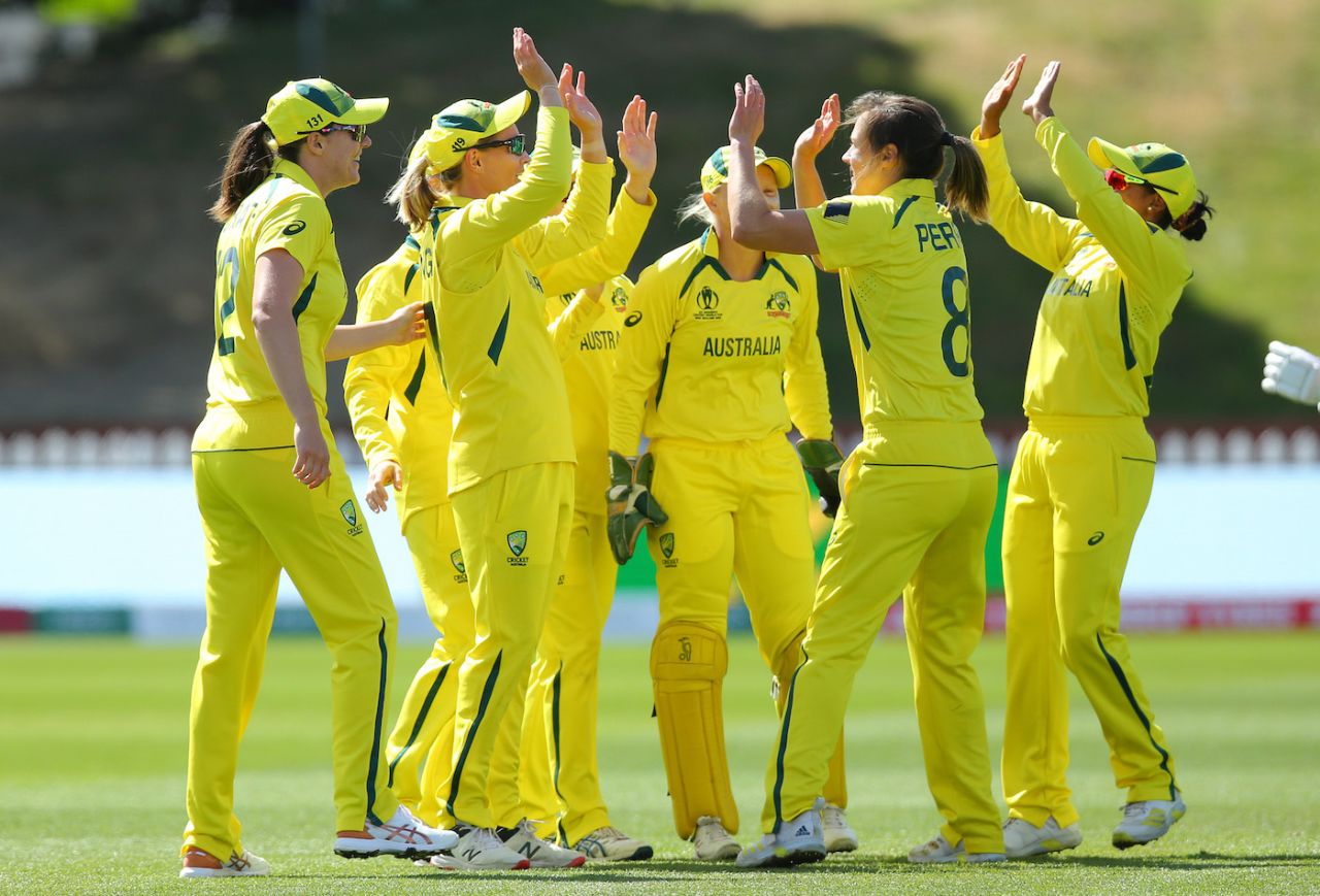 Australia players gather around to celebrate with Ellyse Perry, Australia vs West Indies, Women's World Cup 2022, Wellington, March 15, 2022