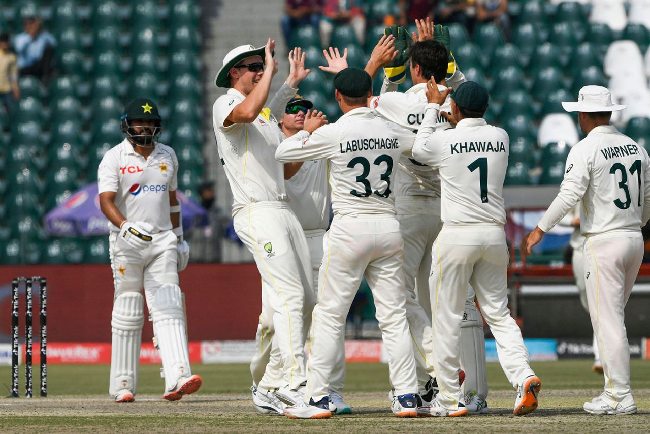 Australia celebrate Pat Cummins' catch to remove Azhar Ali, Pakistan v Australia, 3rd Test, Lahore, 3rd day, March 23, 2022