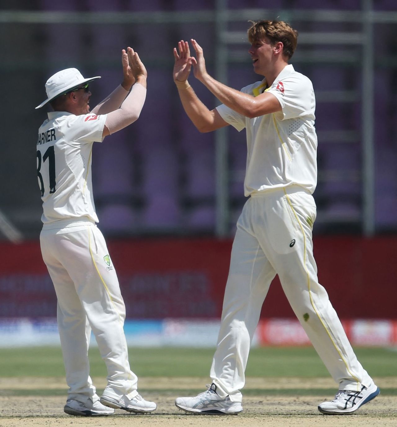 Cameron Green celebrates the wicket of Azhar Ali with David Warner, Pakistan vs Australia, 2nd Test, Karachi, 4th day, March 15, 2022