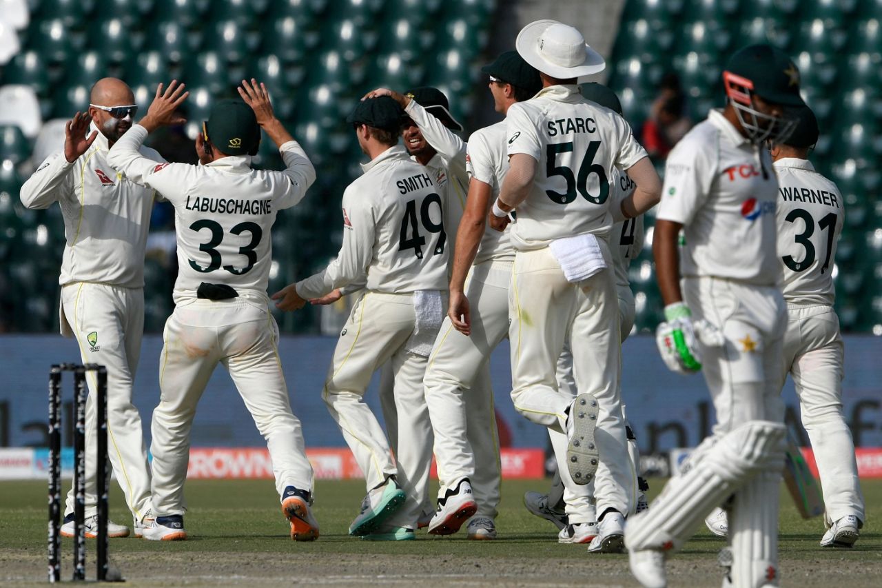 Nathan Lyon celebrates with team-mates, as Babar Azam walks back, Pakistan vs Australia, 3rd Test, Lahore, 5th day, March 25, 2022