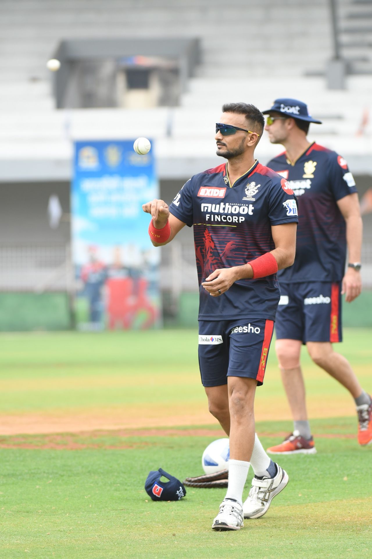 Harshal Patel tosses the ball up, Mumbai, March 26, 2022