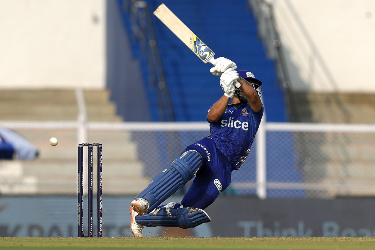 Ishan Kishan loses his balance as he throws his bat at a widish delivery, Delhi Capitals vs Mumbai Indians, IPL 2022, Mumbai, March 27, 2022