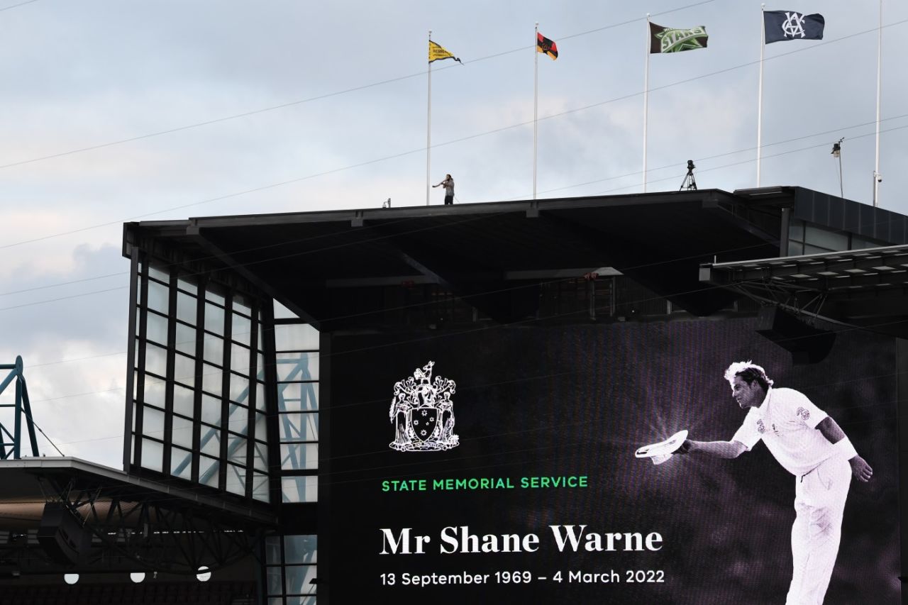 The flags of Shane Warne's teams fly high at the MCG at his state memorial, Melbourne, March 30, 2022