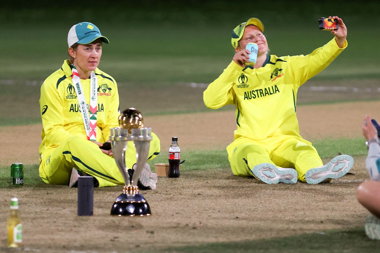 Rachael Haynes and Alyssa Healy relax with the spoils, and a beverage or two, Australia vs England, Women's World Cup 2022 final, Christchurch, April 3, 2022