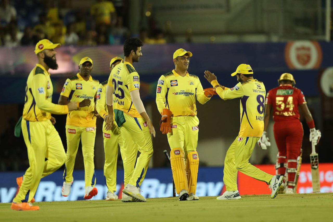 The Super Kings players celebrate after MS Dhoni pulled off a stunning run-out, of Bhanuka Rajapanksa, Chennai Super Kings vs Punjab Kings, IPL 2022, Mumbai, April 3, 2022