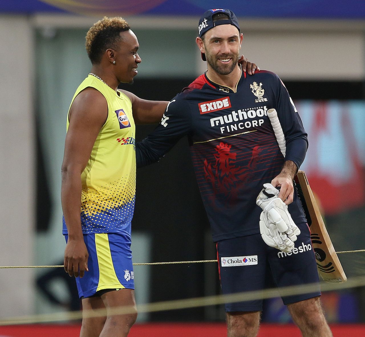Dwayne Bravo and Glenn Maxwell exchange pleasantries before their warm-up drills, Chennai Super Kings vs Royal Challengers Bangalore, IPL 2022, DY Patil Stadium, Mumbai, April 12, 2022