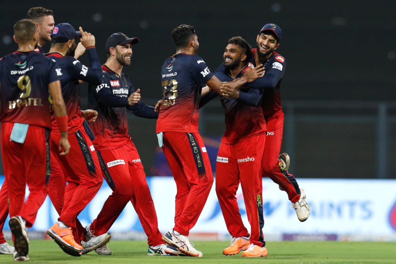 Royal Challengers Bangalore erupt in joy as the DRS overturns a not-out lbw call against David Warner off Wanindu Hasaranga, Delhi Capitals vs Royals Challengers Bangalore, IPL 2022, Wankhede Stadium, Mumbai, April 16, 2022