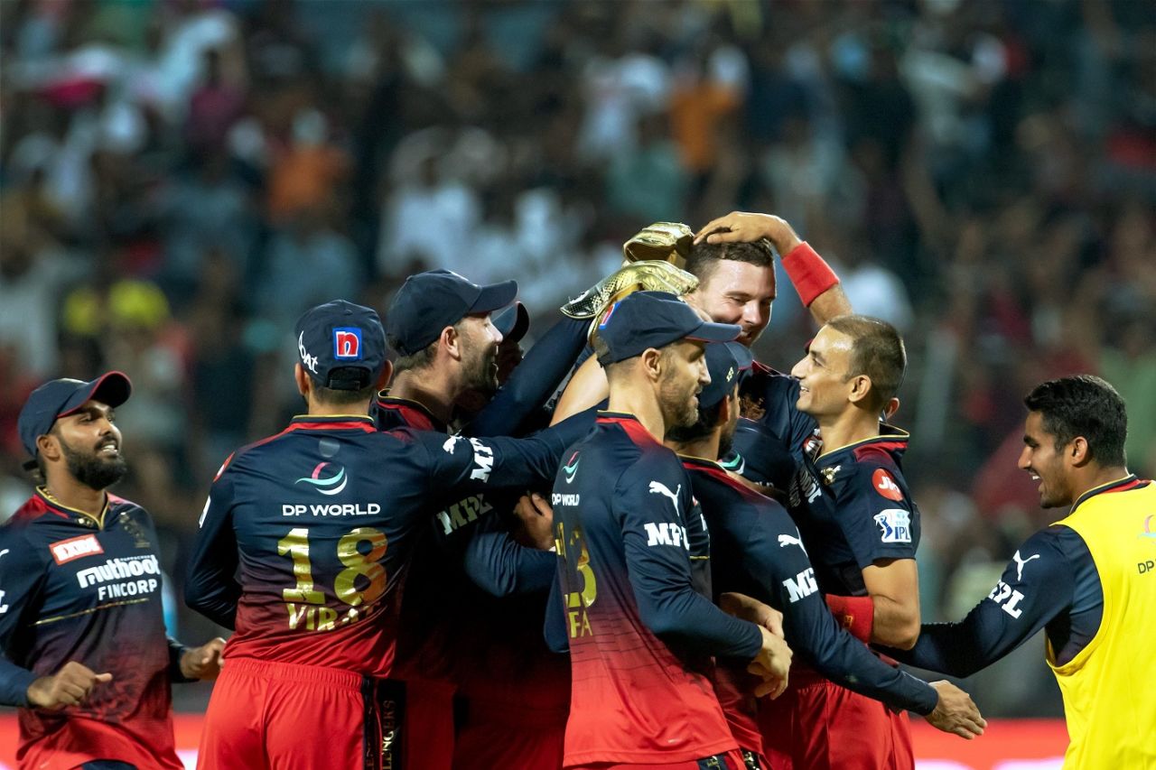 Royal Challengers celebrate the wicket of Jos Buttler, Rajasthan Royals vs Royal Challengers Bangalore, IPL 2022, Pune, April 26, 2022