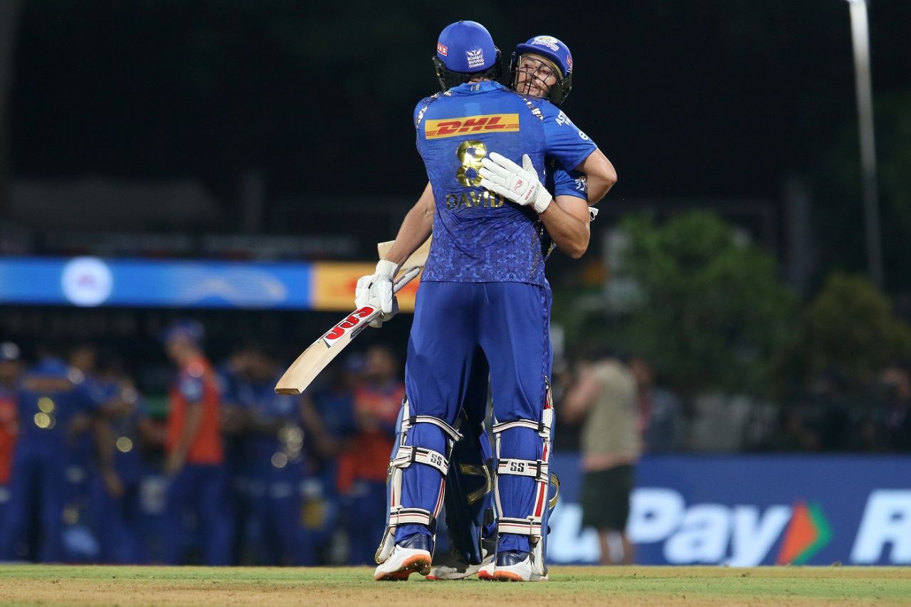 Daniel Sams and Tim David embrace as Mumbai Indians finally got their winning counter running, Mumbai Indians vs Rajasthan Royals, IPL 2022, DY Patil, Navi Mumbai, April 30, 2022