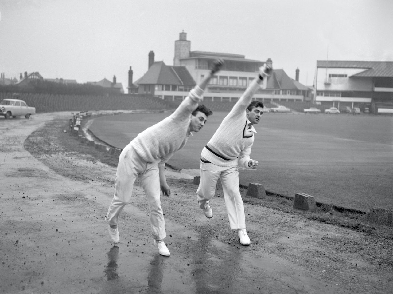 Fred Trueman, right, delivers the ball at the same time as his 18 year old brother Dennis Trueman, during practice at Headingley, Leeds, April 7, 1961