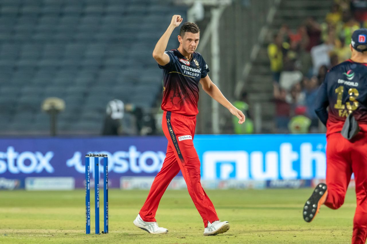 Josh Hazlewood celebrates after effectively sealing the game for RCB by removing CSK's captain, MS Dhoni, Chennai Super Kings vs Royal Challengers Bangalore, IPL 2022, Pune, May 4, 2022