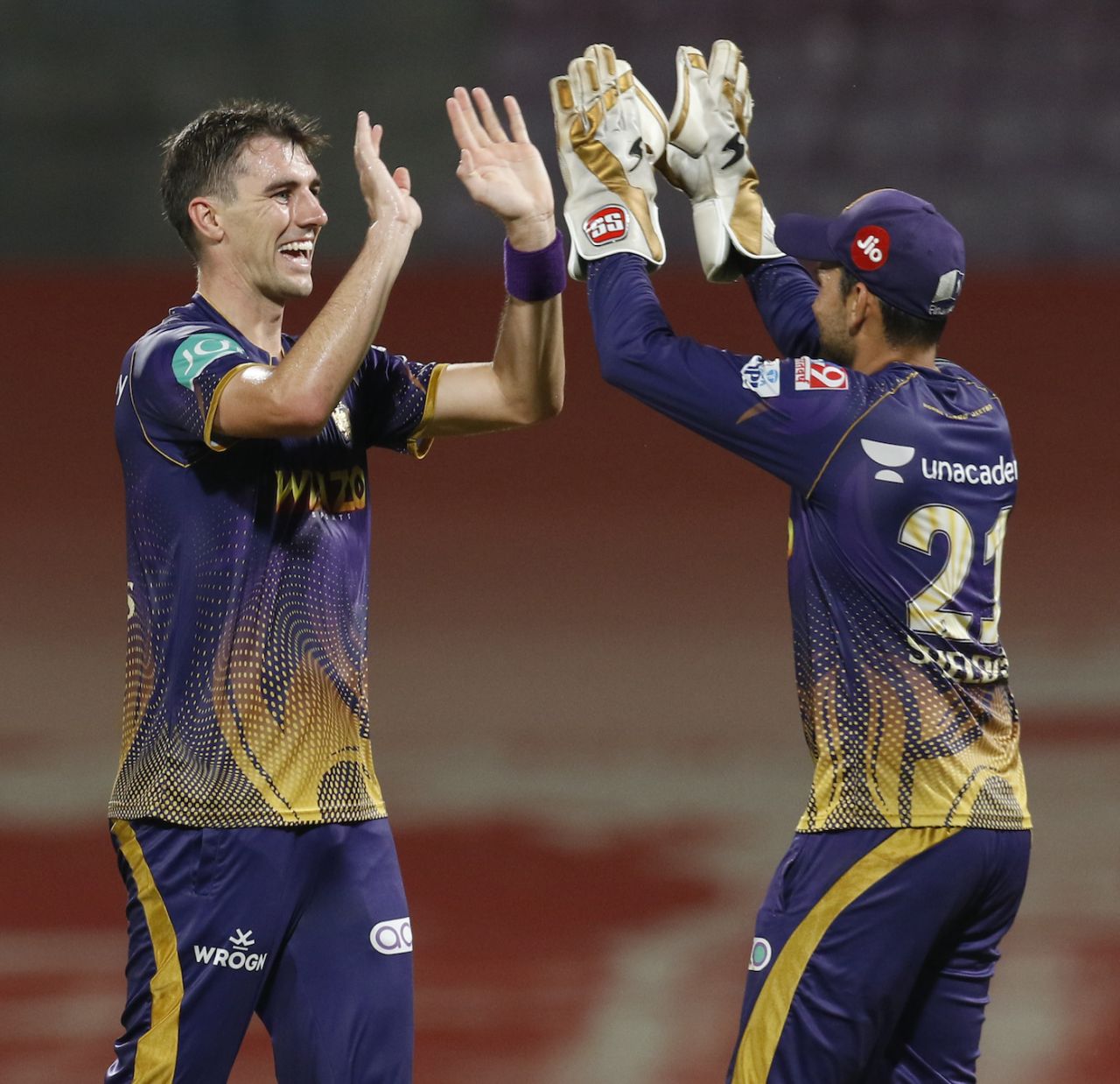 Pat Cummins and Sheldon Jackson celebrate after combining to remove Daniel Sams, Kolkata Knight Riders vs Mumbai Indians, IPL 2022, DY Patil Stadium, Mumbai, May 9, 2022
