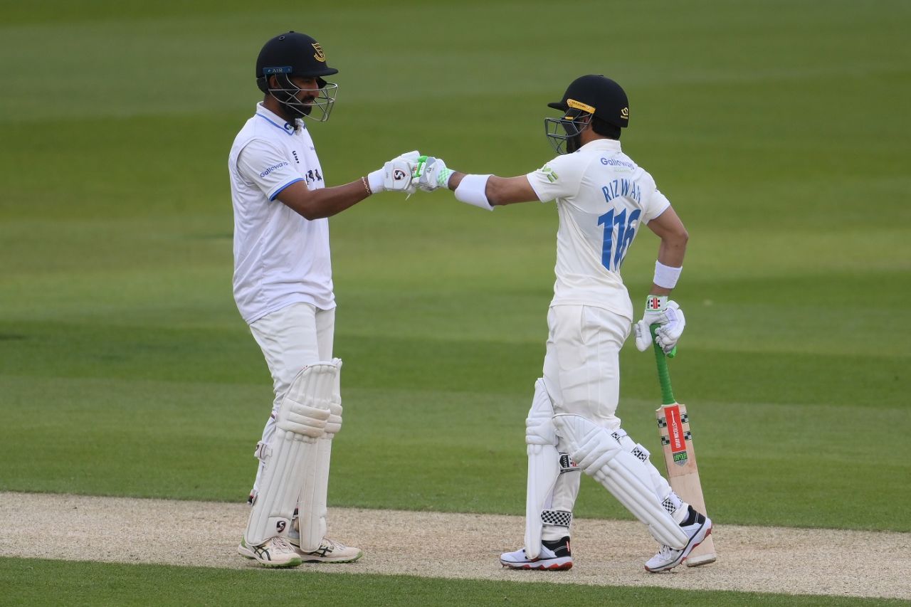 Cheteshwar Pujara and Mohammad Rizwan punch gloves during their partnership, Sussex vs Durham, County Championship Division 2, 2nd day, Hove, April 29, 2022
