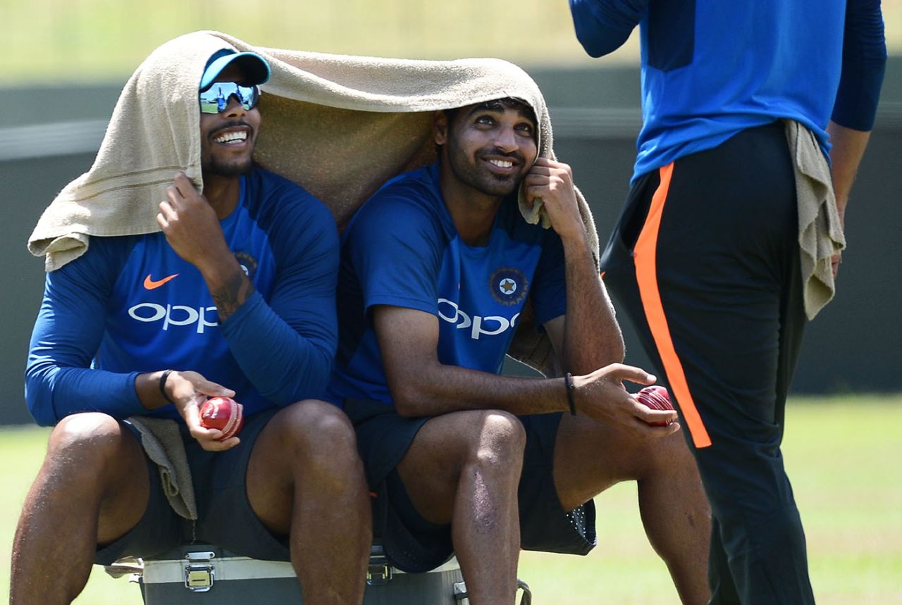 Umesh Yadav and Bhuvneshwar Kumar take a break during a training session, Colombo, August 1, 2017