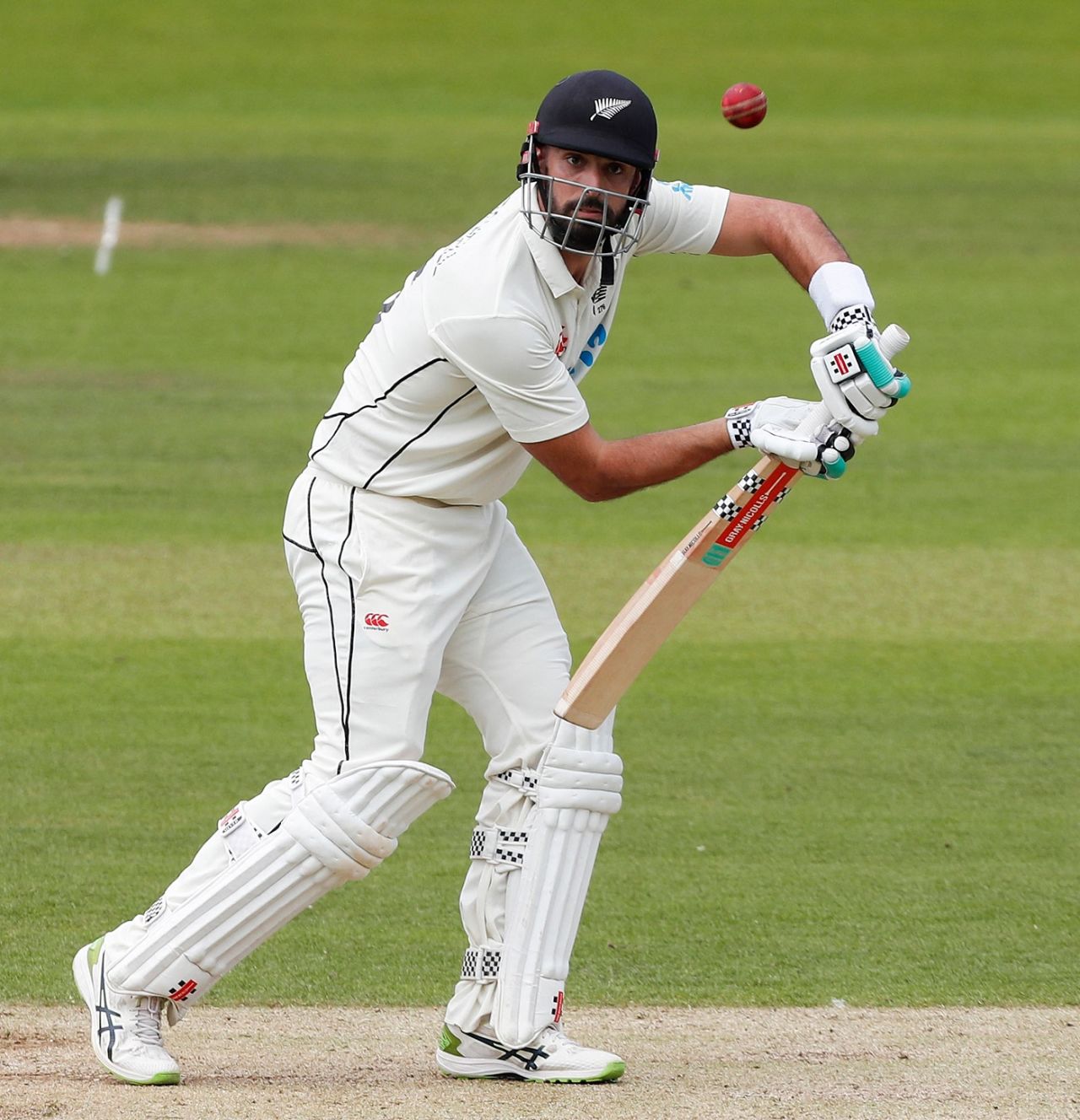 Daryl Mitchell presents a perfect pose as he defends one to the off side, England vs New Zealand, 1st Test, Lord's, London, 2nd day, June 3, 2022
