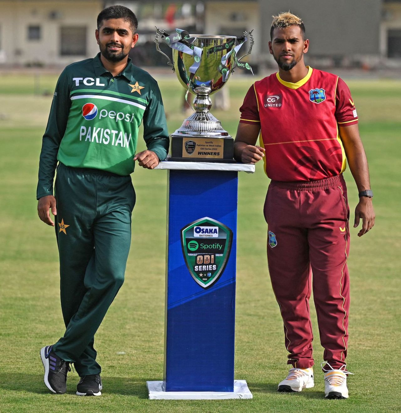 Babar Azam and Nicholas Pooran pose with the trophy they will be battling for, Multan, June 7, 2022
