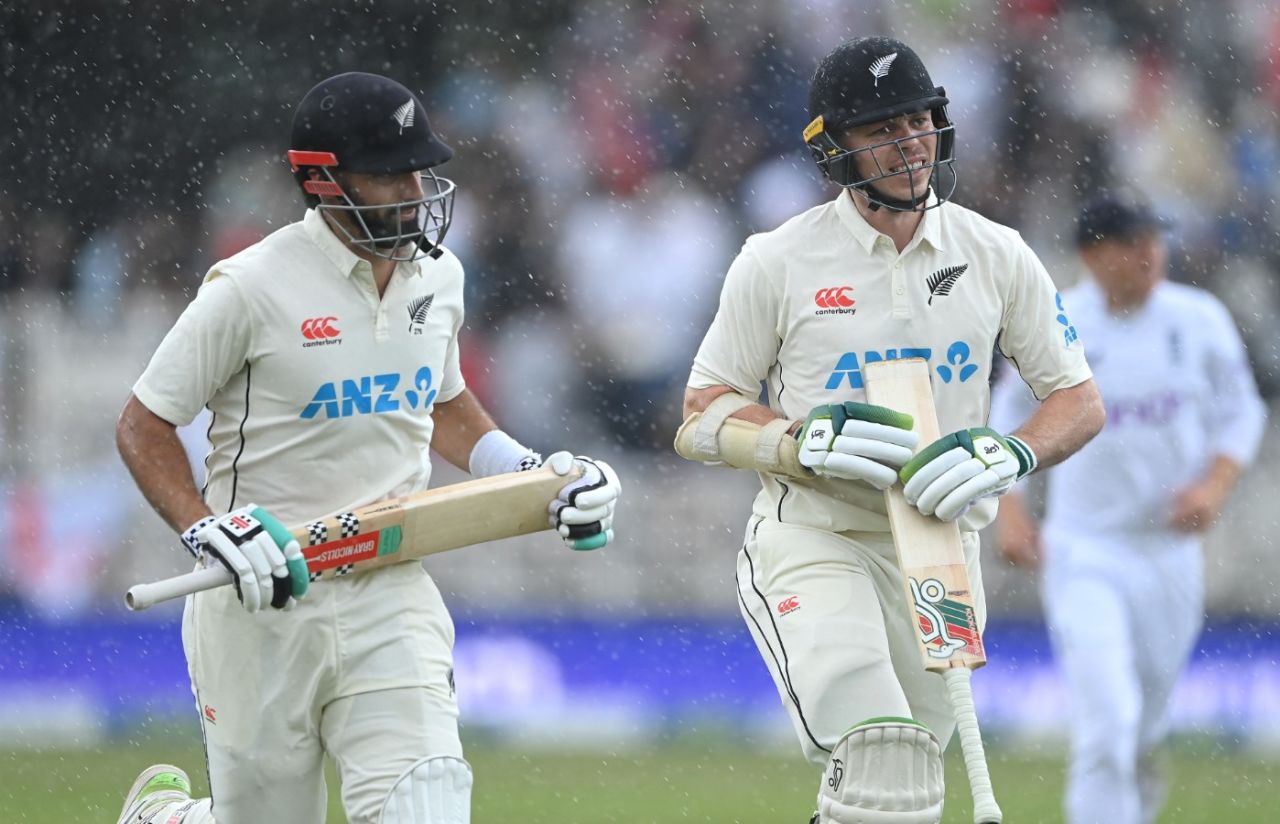 Daryl Mitchell and Michael Bracewell run for cover as the rain comes down, England vs New Zealand, 2nd Test, Nottingham, 2nd day, June 11, 2022