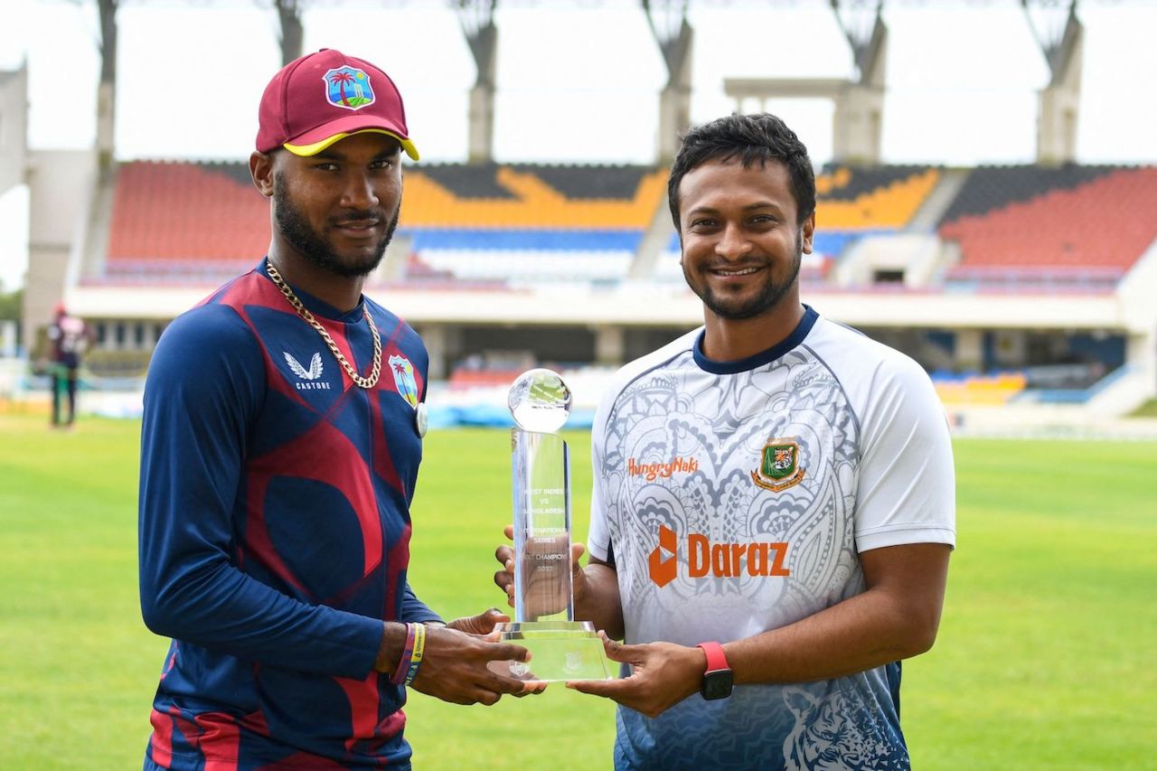 Kraigg Brathwaite and Shakib Al Hasan with the Test series trophy, North Sound, June 15, 2022