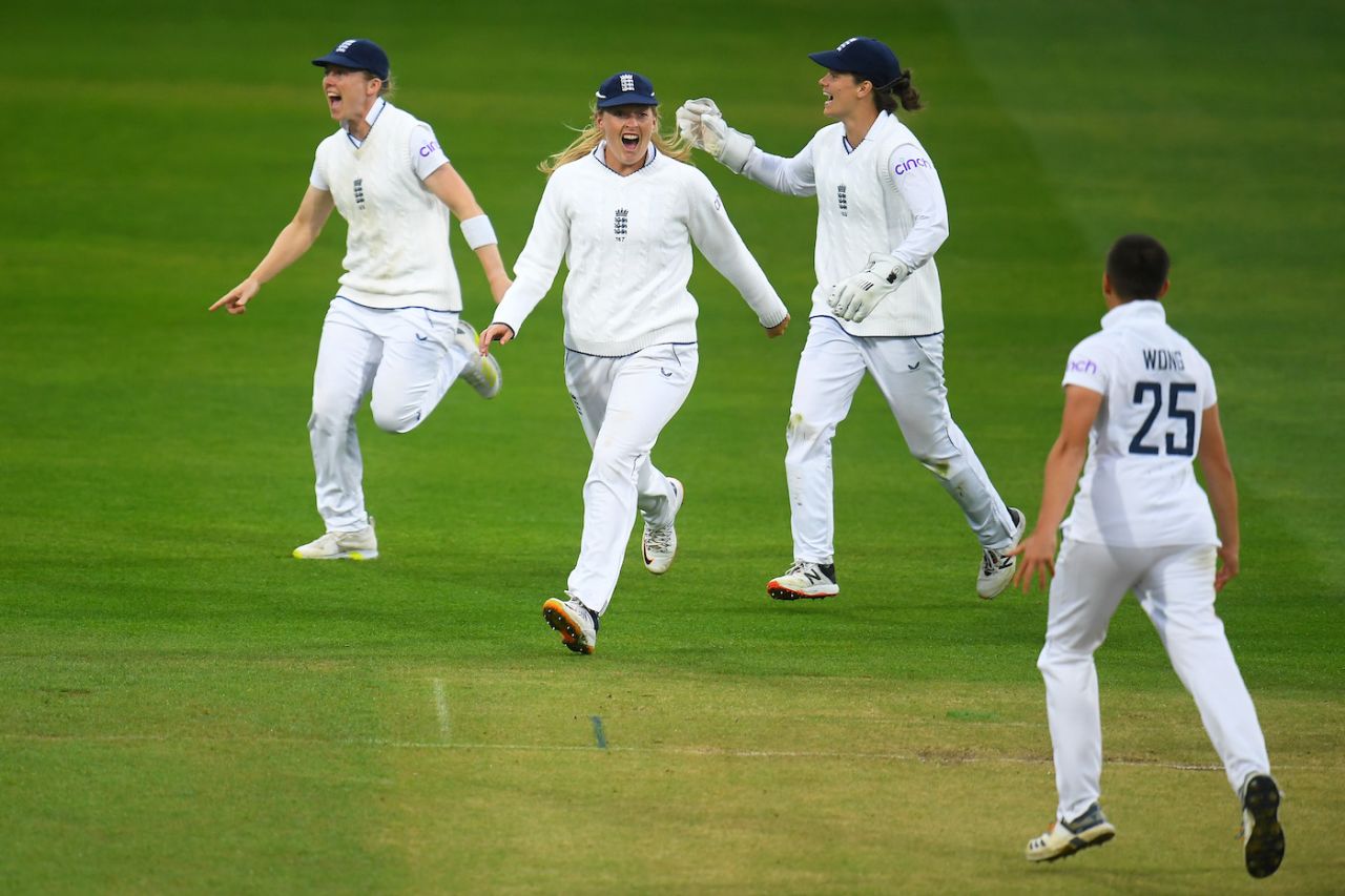 Heather Knight, Sophie Ecclestone and Amy Jones celebrate a wicket with Issy Wong, England vs South Africa, Only Women's Test, Taunton, 3rd day, June 29, 2022
