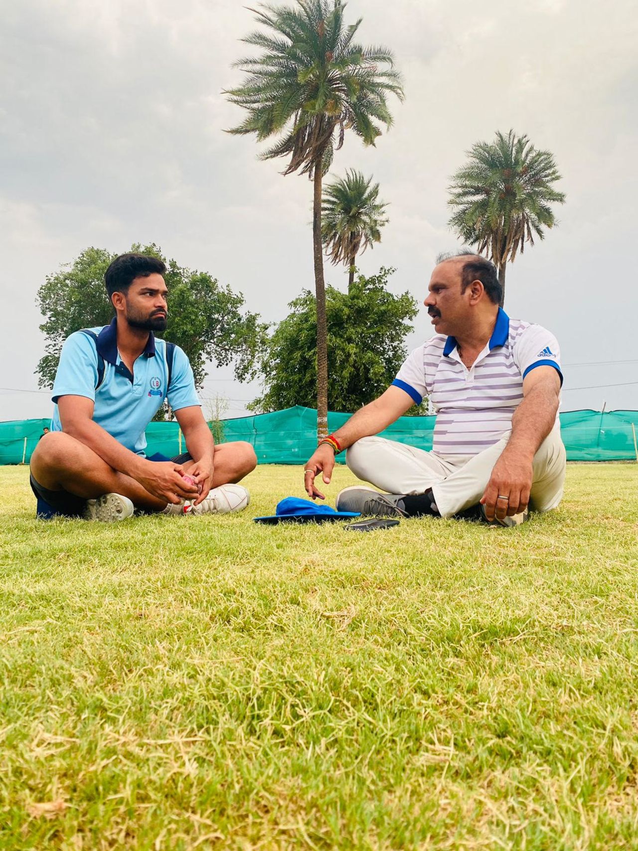 Kumar Kartikeya (left) chats with coach Sanjay Bhardwaj during training