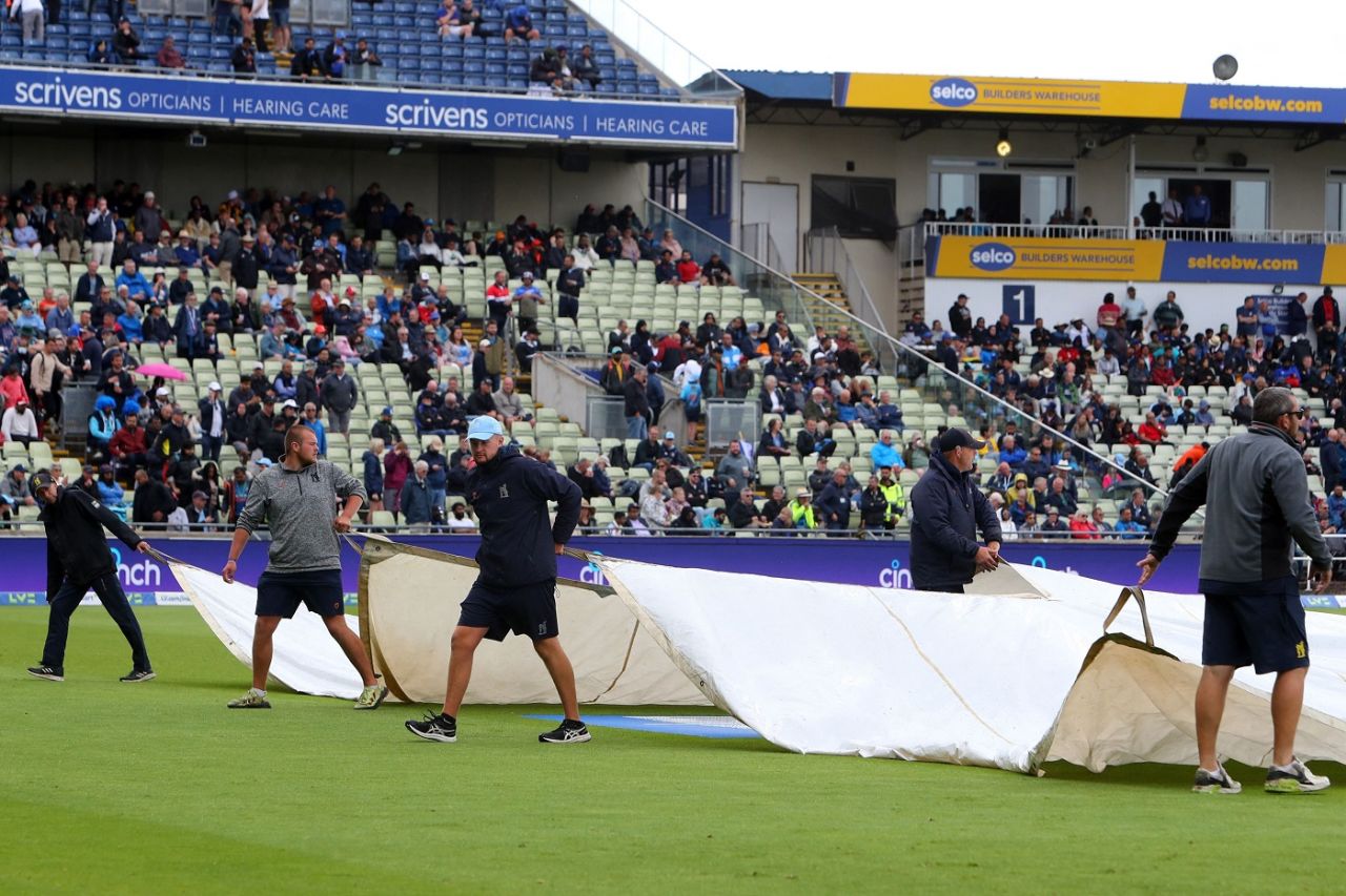 The groundstaff remove covers as play resumed after a lengthy rain delay, 5th Test, Birmingham, 2nd day, July 2, 2022