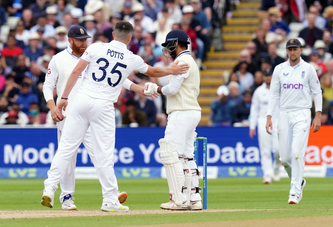 The England players check on Shardul Thakur after he copped a blow to the helmet off Matthew Potts, England vs India, 5th Test, Birmingham, 4th day, July 4, 2022