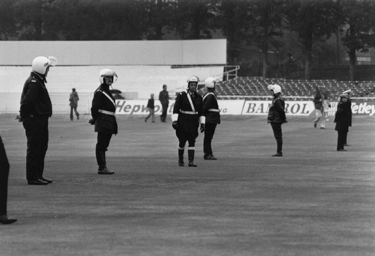 Policemen protect the Test Match pitch at Headingley, August 28, 1975