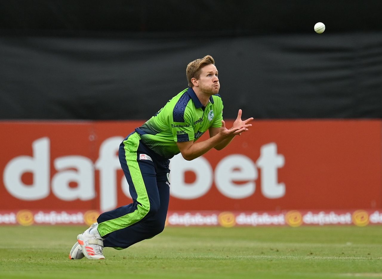 Barry McCarthy has his eyes on the ball as he dives to complete a catch to dismiss Finn Allen, Ireland vs New Zealand, 2nd T20I, Belfast, July 20, 2022