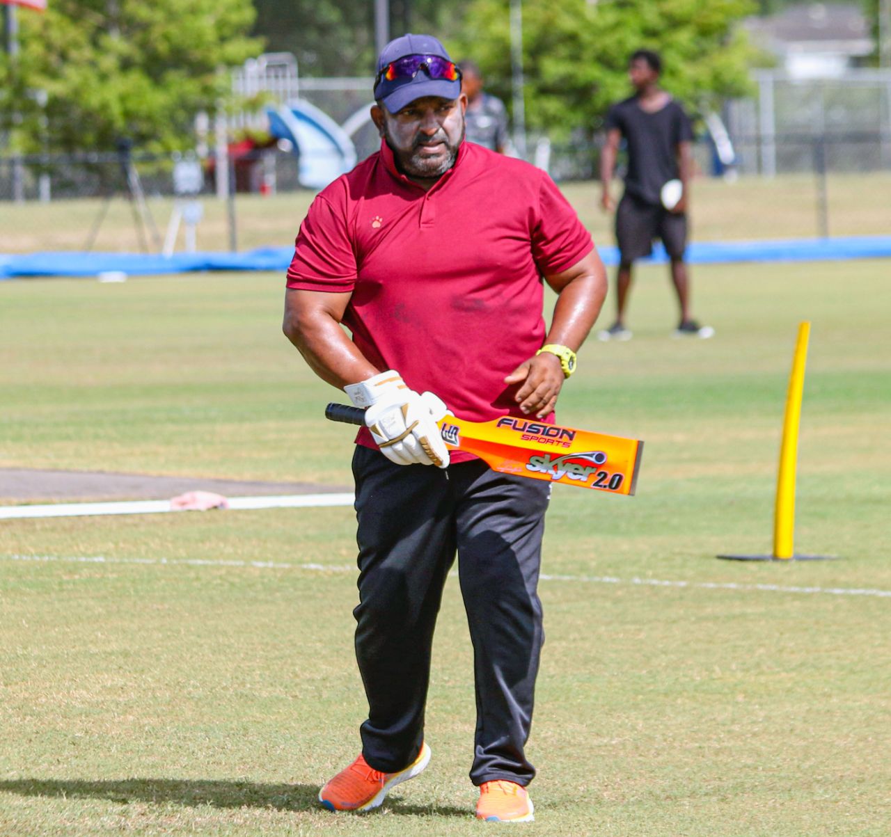 Nepal head coach Pubudu Dassanayake hits catches during pregame warmups, USA v Nepal, ICC Cricket World Cup League Two, Pearland, June 11, 2022