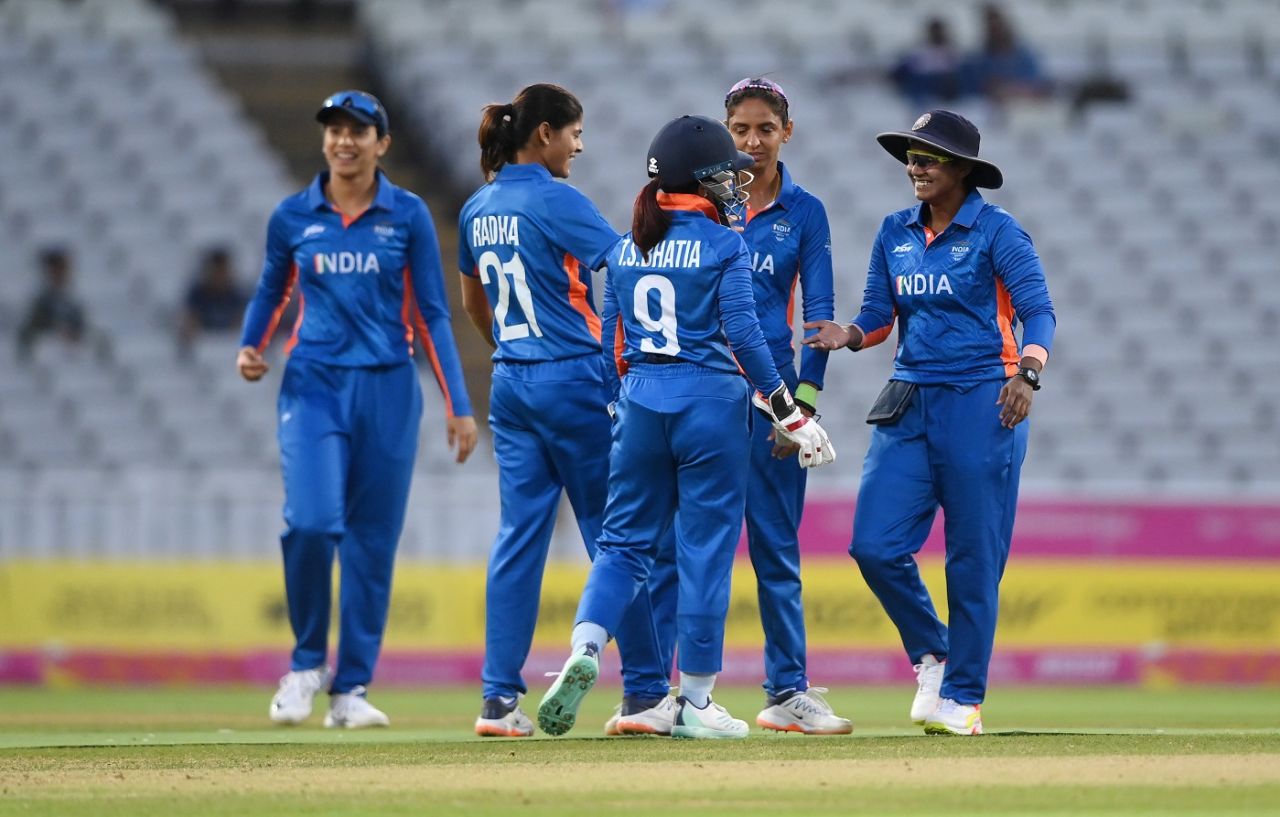 The Indian team gathers around Radha Yadav to celebrate a wicket, Barbados vs India, Commonwealth Games 2022, Birmingham, August 3, 2022