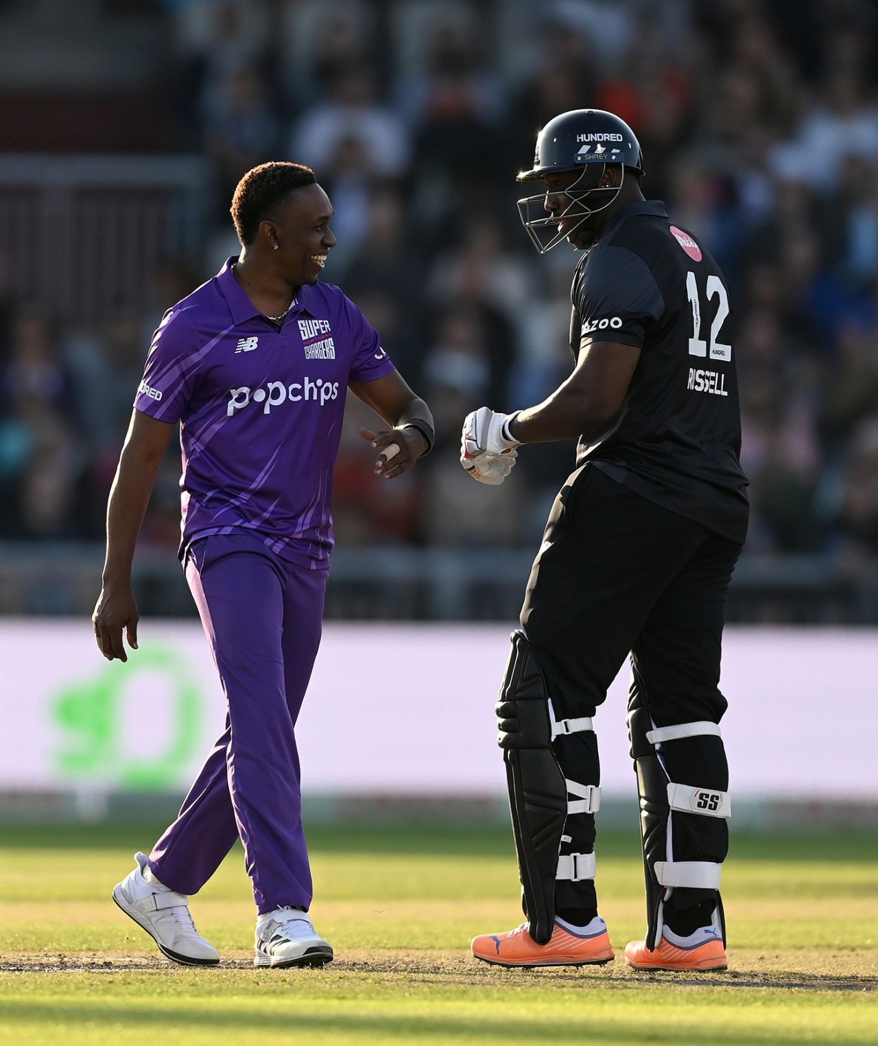 Dwayne Bravo and Andre Russell share a joke, Manchester Originals Men vs Northern Superchargers, The men's Hundred, Manchester, Emirates Old Trafford, August 5, 2022