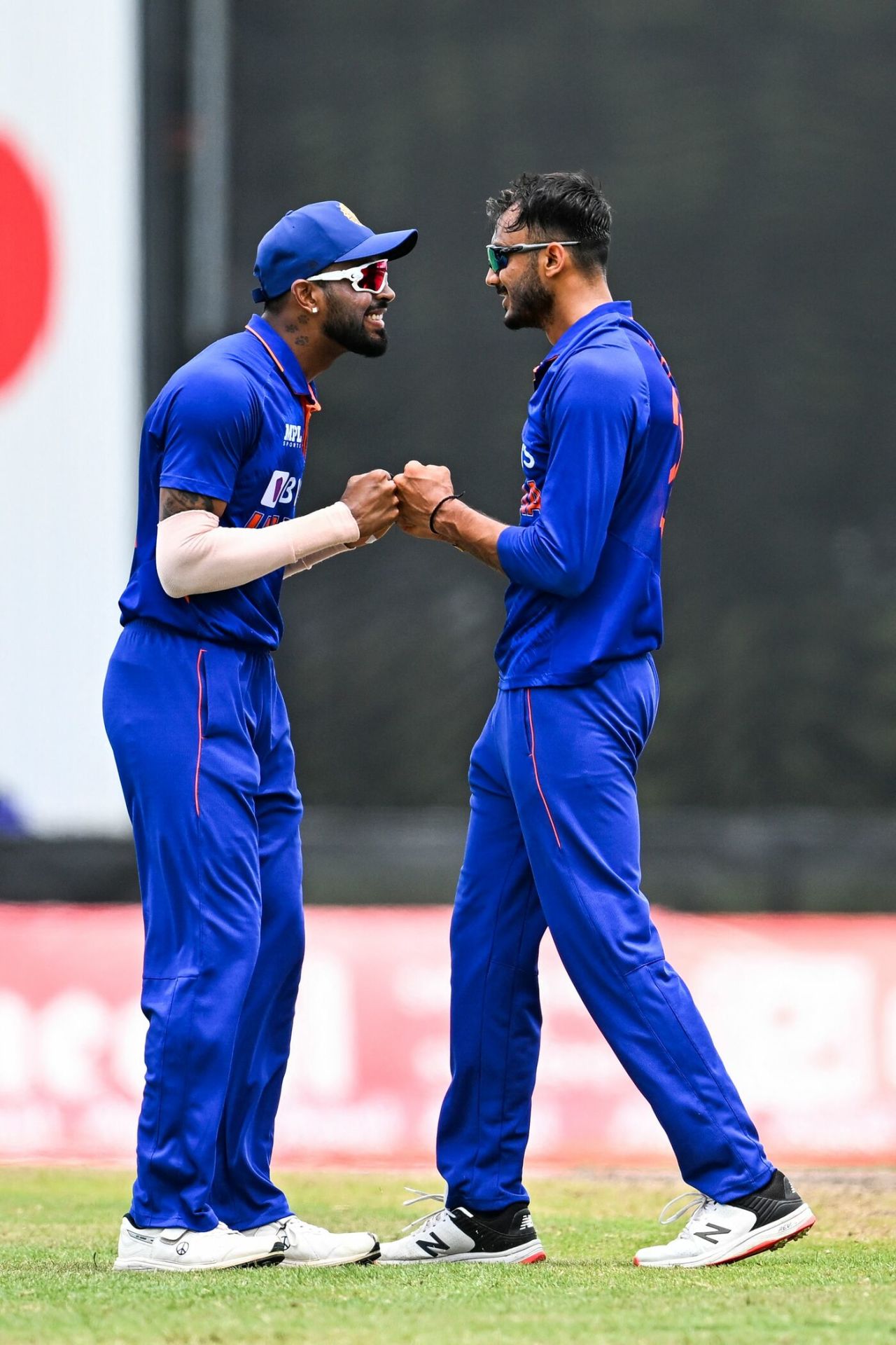 Hardik Pandya and Axar Patel share a moment after the latter strikes, West Indies vs India, 5th T20I, Lauderhill, August 7, 2022