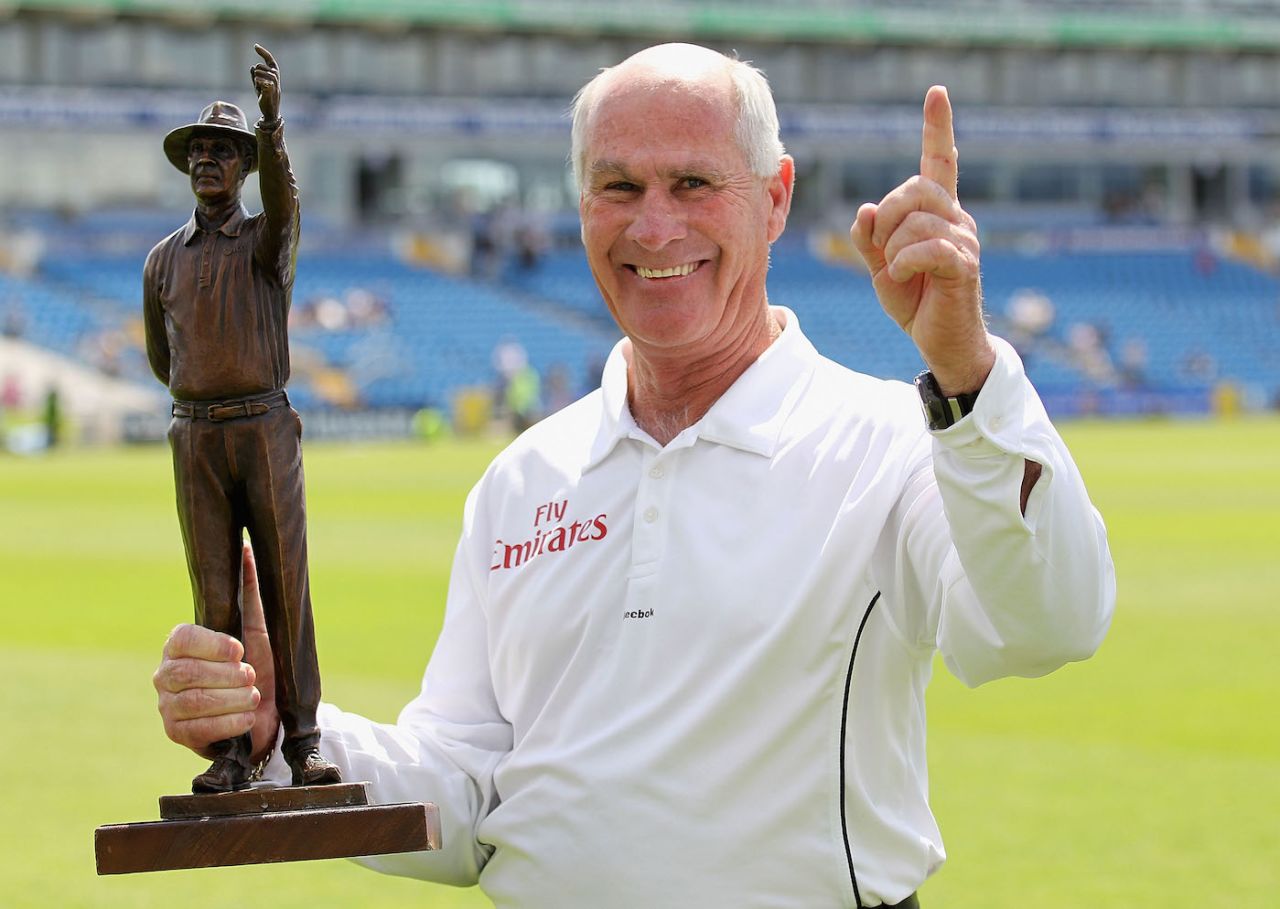 Rudi Koertzen poses with a trophy presented to him after his final Test, Leeds, July 24, 2010