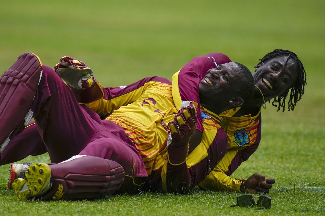 Hayden Walsh embraces Devon Thomas after the latter completed a good catch to remove Devon Conway, West Indies v New Zealand, 1st T20I, Kingston, August 10, 2022