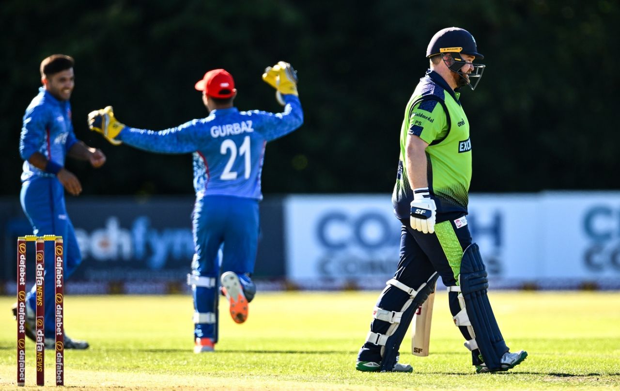Fazalhaq Farooqi and Rahmanullah Gurbaz celebrate in the background after dismissing Paul Stirling early, Ireland vs Afghanistan, 3rd T20I, Belfast, August 12, 2022