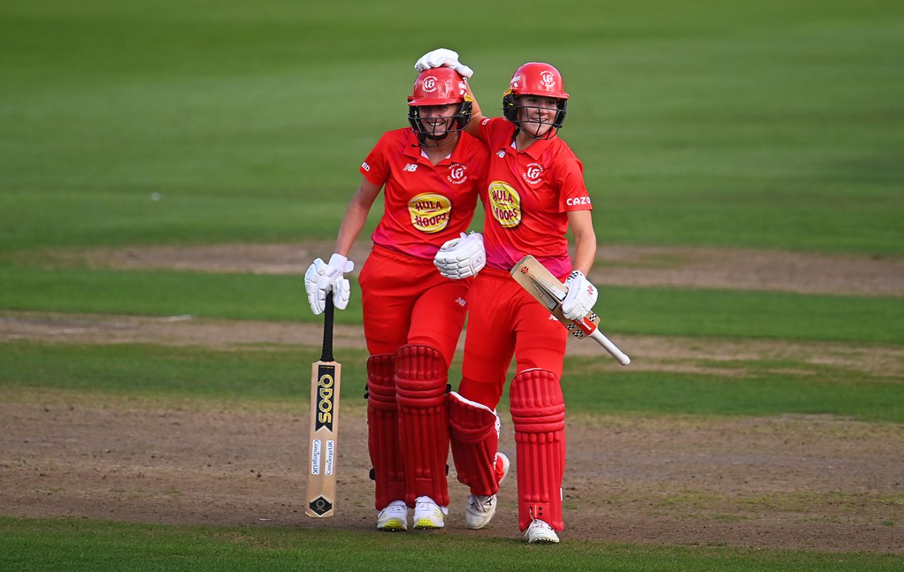 Lauren Filer gets a pat on the helmet from Annabel Sutherland, Welsh Fire vs Northern Superchargers, Women's Hundred, Cardiff, August 26, 2022